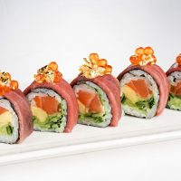 Luxury sushi rolls with gold leaves